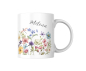 Preview: Weiße Keramiktasse mit handgemaltem Aquarellblumen-Motiv und personalisiertem Namen „Milena“, freigestellt auf weißem Hintergrund.